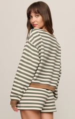 Z SUPPLY Low Key Stripe Sweatshirt in Monstera, back view on model, olive green and cream horizontal stripes with tan hem band, paired with matching shorts
