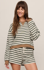 Z SUPPLY Low Key Stripe Sweatshirt in Monstera, olive green and cream stripes with tan trim, worn by model with matching shorts