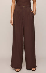 Z SUPPLY Magnolia Linen Pant in Chocolate Cherry — wide-leg, high-waist trousers with pleats and gold button, front view on model