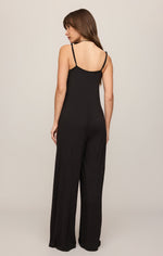 Z SUPPLY Leyla Jumpsuit in Black — back view on model, wide-leg silhouette, open back with thin adjustable straps