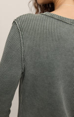 Z SUPPLY Arlet Mini Thermal Top in Monstera green, back detail close-up showing waffle-knit texture and raw-edge seams on model