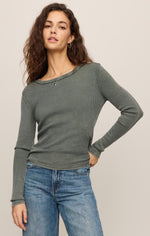 Z SUPPLY Arlet Mini Thermal Top in Monstera green waffle-knit fabric, long sleeves, scoop neck, worn by model with blue jeans, front view.