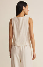 Z SUPPLY Roman Linen Vest in Cloud - back view of model wearing sleeveless cream-colored linen top with matching wide-leg pants