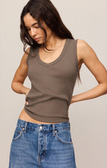 Z SUPPLY Ellie V-Neck Tank in Pebble Coast, a fitted taupe-brown sleeveless top with scoop V-neckline, worn by model with blue jeans.