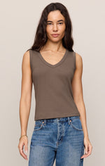 Z SUPPLY Ellie V-Neck Tank in Pebble Coast, a muted olive-taupe sleeveless top with wide straps, worn by model with blue jeans, front view.