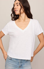 Z SUPPLY Nomad V-Neck Tee in white, front view on model, paired with light-wash jeans, short sleeves and relaxed fit.
