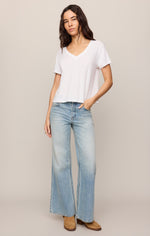 Z SUPPLY Nomad V Neck Tee in white, short-sleeve relaxed crop fit, worn by model with wide-leg jeans, front view