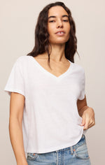 Z SUPPLY Nomad V Neck Tee in White, front view on model, featuring relaxed fit, short sleeves, and V-neckline, styled with blue jeans.