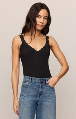 Z SUPPLY Eve Lace Tank in Black, front view on model, featuring scalloped lace V-neckline and wide straps, paired with blue jeans.