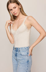 Z SUPPLY Eve Lace Tank in Sandstone, cream V-neck camisole with scalloped lace trim, worn with light wash jeans, front view on model.