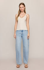Z SUPPLY Eve Lace Tank in Sandstone, cream V-neck cami with lace trim straps, worn with light wash wide-leg jeans, front view on model.