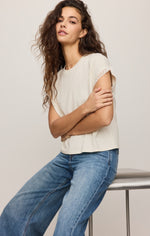 Z SUPPLY Marika Lace Trim Muscle Tee in Cloud — cream short-sleeve top with lace sleeve trim, worn by model with wide-leg jeans, front view
