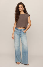 Z SUPPLY Flex Sleeveless Tee in Pebble Coast — cropped muscle tee in warm taupe-brown on model, front view