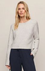 Z SUPPLY Stand In Sweater in Feather Grey, a cropped fuzzy knit with crew neck and long sleeves, worn by model with navy joggers