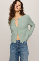 Z SUPPLY Medina Cardigan in Mint Julep, a soft sage-green knit with button front, worn open over jeans by a model