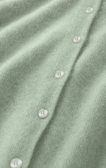 Z SUPPLY Medina Cardigan close-up detail showing soft mint green knit fabric with pearlescent two-hole buttons along front placket