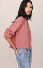 Z SUPPLY Coming Up Sweater in Desert Bloom — dusty rose cropped knit sweater on model, back/side view, paired with light-wash jeans