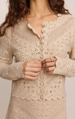 Z SUPPLY Cressa Cardigan in Natural — close-up detail of scalloped crochet knit, button front closure, and lace trim on model