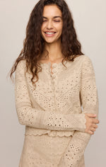 Z SUPPLY Cressa Cardigan in Natural — model wearing cream crochet knit cardigan with button front and scalloped hem detail