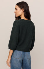 Z Supply Valor Cardigan in Emerald Cove, back view on model, dark green knit with 3/4 puff sleeves, paired with blue jeans