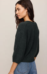 Z Supply Valor Cardigan in Emerald Cove, back view on model, dark green knit with 3/4 sleeves, paired with blue jeans