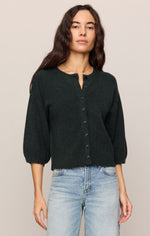 Z SUPPLY Valor Cardigan in Emerald Cove, a dark green knit cardigan with button front and 3/4 puff sleeves, worn by a model with jeans.
