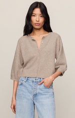 Z SUPPLY Valor Cardigan in Natural Heather — cropped knit cardigan with 3/4 sleeves and button front, worn by model with blue jeans