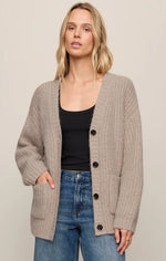 Z SUPPLY Whitmore Cardigan in light khaki, oversized button-front knit with patch pockets, worn over black tank with jeans, front view
