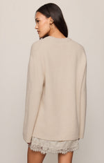 Z SUPPLY Chill Mode Sweater in Frosted Pearl — back view on model, oversized cream knit with raglan sleeves and lace skirt beneath