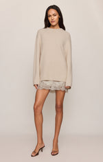 Z SUPPLY Chill Mode Sweater in Frosted Pearl — oversized cream knit pullover with dropped shoulders, worn by model with lace mini skirt