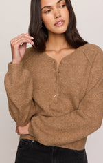 Z SUPPLY Westmont Henley Sweater in Golden Caramel, front view on model, featuring soft knit fabric, balloon sleeves, and button placket