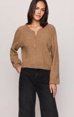 Z SUPPLY Westmont Henley Sweater in Golden Caramel, front view on model, featuring raglan sleeves, henley neckline with buttons, and cropped fit