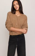 Z SUPPLY Westmont Henley Sweater in Golden Caramel, featuring raglan sleeves and button placket, worn by model with black jeans