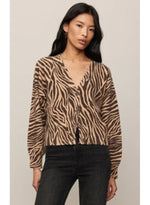 Z SUPPLY All The Wild Cardigan in dark chocolate zebra print, V-neck button-front style, worn by model with black jeans, front view.