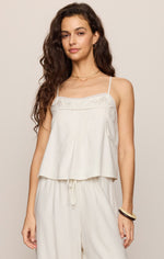 Z SUPPLY Lille Embroidered Woven Tank in white, front view on model, featuring lace trim, spaghetti straps, and flowy silhouette