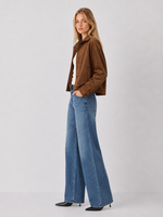 Z SUPPLY Corin Bubble Hem Jacket in Saddle Suede brown, worn by model with wide-leg jeans, side view showing textured fabric and collar