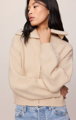 Z SUPPLY Silverlake Cardigan in chalk, a cream zip-up knit sweater with collar, worn by a model with blue jeans