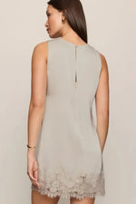 Z Supply Meadow Muse Lace Mini Dress in Frosted Pearl, back view on model showing lace hem trim and keyhole closure