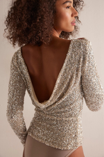 Free People Leading The Way LS silver sequin long-sleeve bodysuit with dramatic cowl back, shown on model from behind