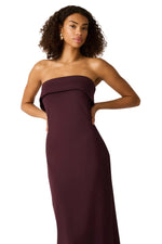 Steve Madden Roslynn Dress in Chocolate — strapless bandeau-top maxi dress in deep burgundy-brown on a model, front view