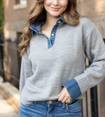 Elan Sweater Collared Denim in grey — model wearing grey knit pullover with denim collar, gold snap buttons, and denim cuffs