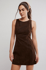 Free People Atlas Suede Mini dress in chocolate brown, sleeveless with round neck, worn by model with patterned headband, front view.