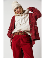 Free People WTF Jona Belt in Rustic Russet, tan leather with gold buckle, worn over cream hoodie with red corduroy pants