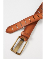 Free People WTF Jona Belt in Rustic Russet tan leather with decorative cut-out slots and antique brass buckle, flat lay close-up