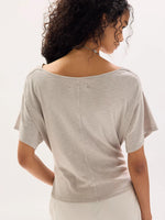 Free People Waterfall Cowl in Chateau Grey, back view on model showing wide scoop neck, center seam, and flutter sleeves