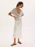 Free People Waterfall Cowl in Chateau Grey worn by model with white lace midi skirt and sandals, front view