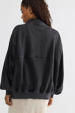 Free People Banks Pullover in Soot Grey, back view on model showing oversized fit, collar, seam detailing, and drop shoulders