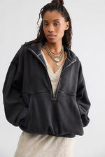 Free People Banks Pullover in Soot Grey, oversized half-zip fleece sweatshirt with balloon sleeves, worn by model over cream lace top.