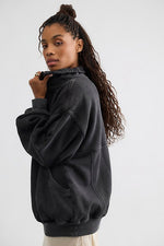 Free People Banks Pullover in Soot Grey, oversized fleece sweatshirt with mock neck and front pocket, side view on model.