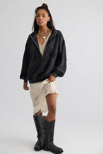 Free People Banks Pullover in Soot Grey, oversized half-zip sweatshirt with drop shoulders, worn by model with lace slip skirt and tall boots